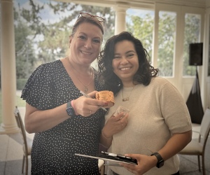 Volunteers Julie Anders, RN, and Paulina Andujo. RN, with the lucky raffle tickets