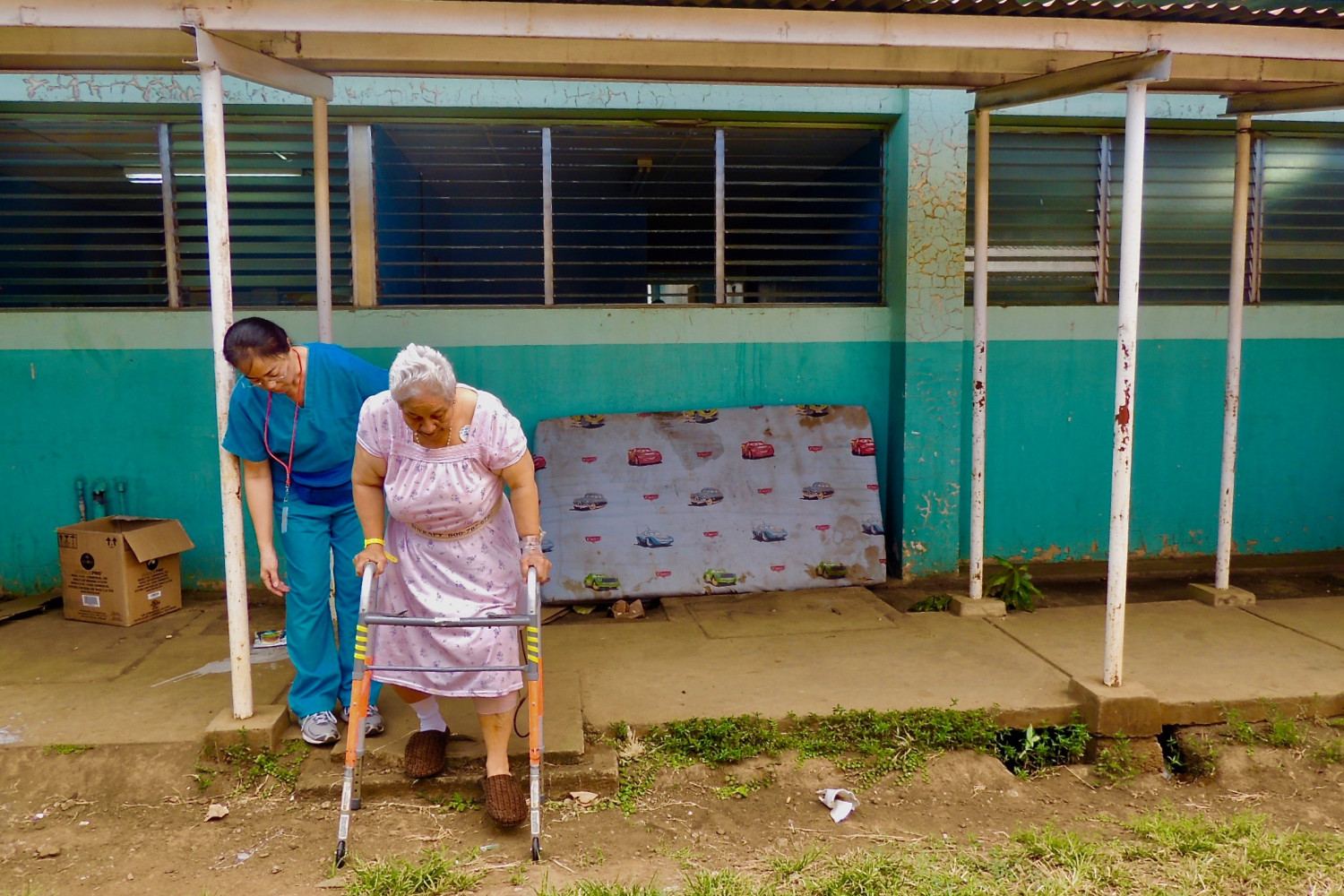Physical Therapist, Vivienne Uytana, works with patient Maria Josefa Mejia on stair training