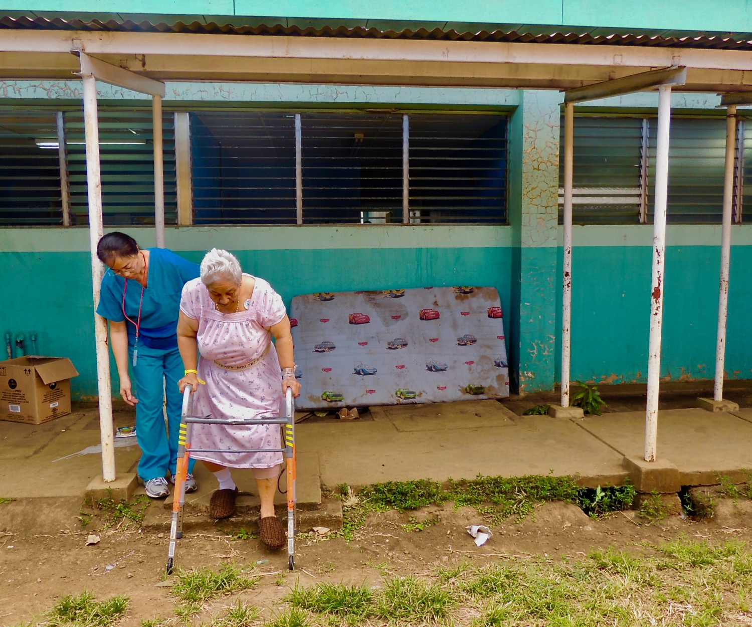 Physical Therapist, Vivienne Uytana, works with patient Maria Josefa Mejia on stair training