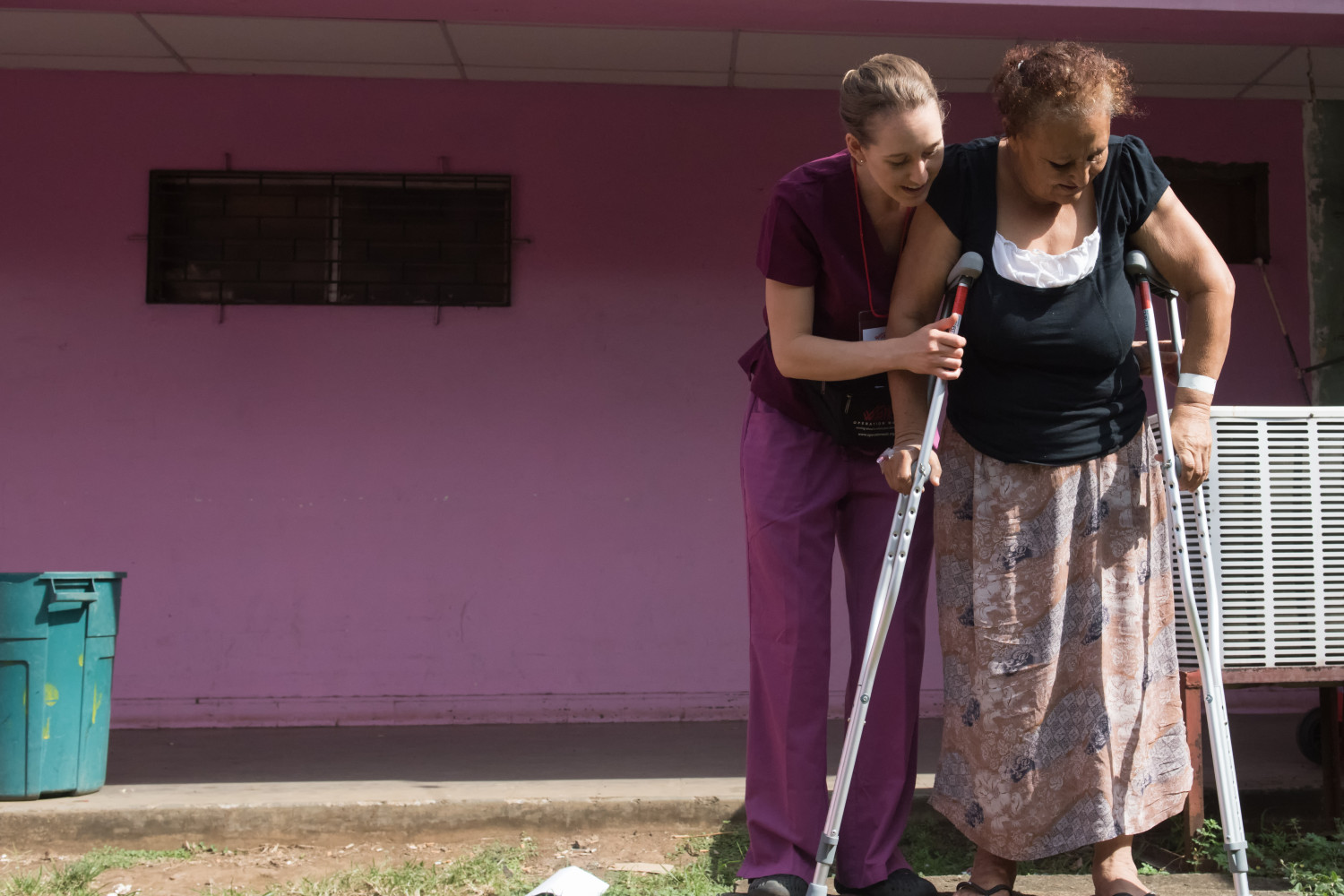 Physical Therapist Kimberly Lennington helps her patient practice using the stairs