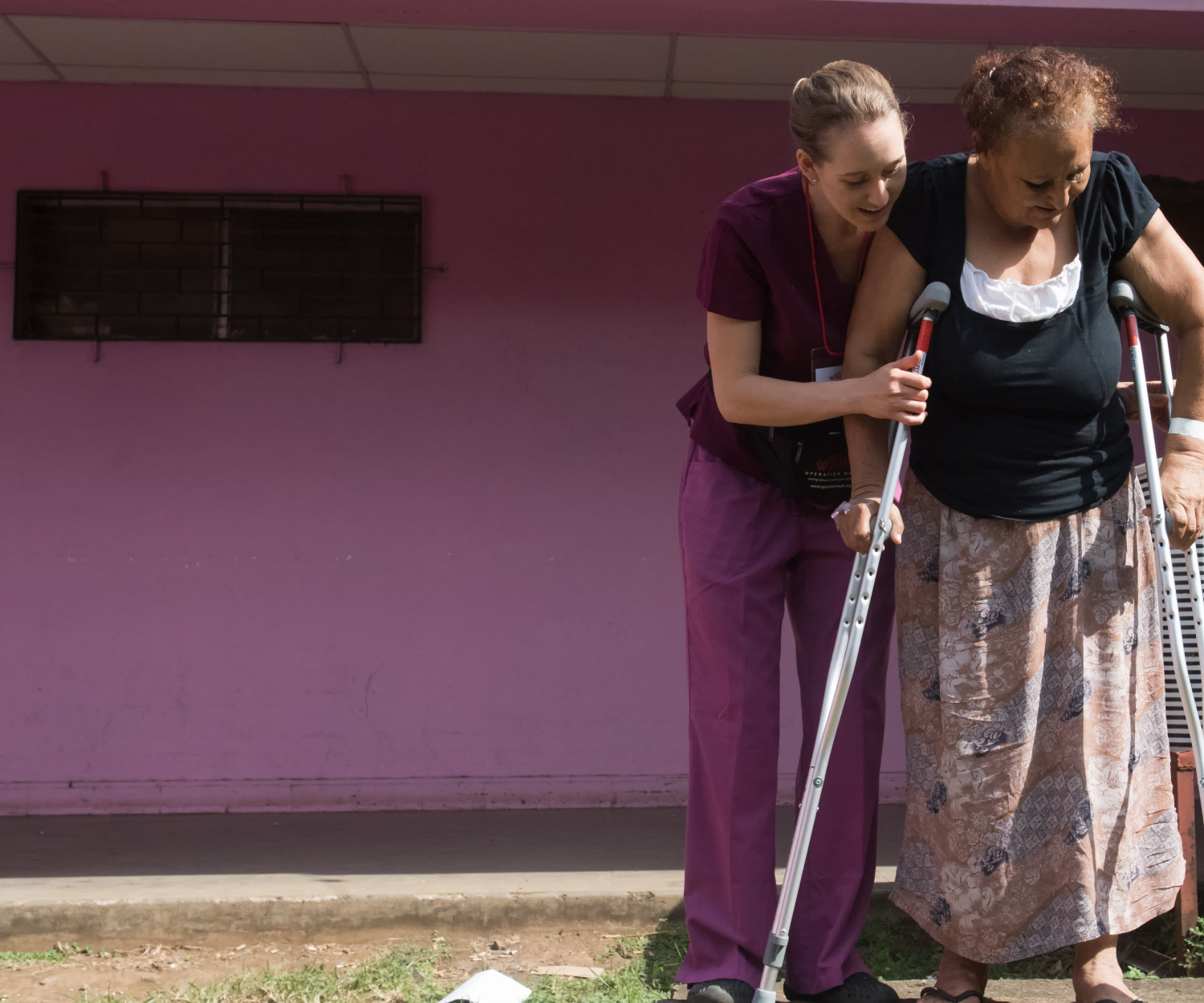 Physical Therapist Kimberly Lennington helps her patient practice using the stairs