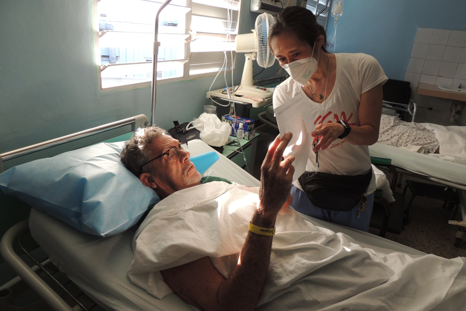 Our PTs help our patients with walking before they head home as well as show them exercises and precautions for the best outcome. Jen Okuno sharing hip precautions with Pedro