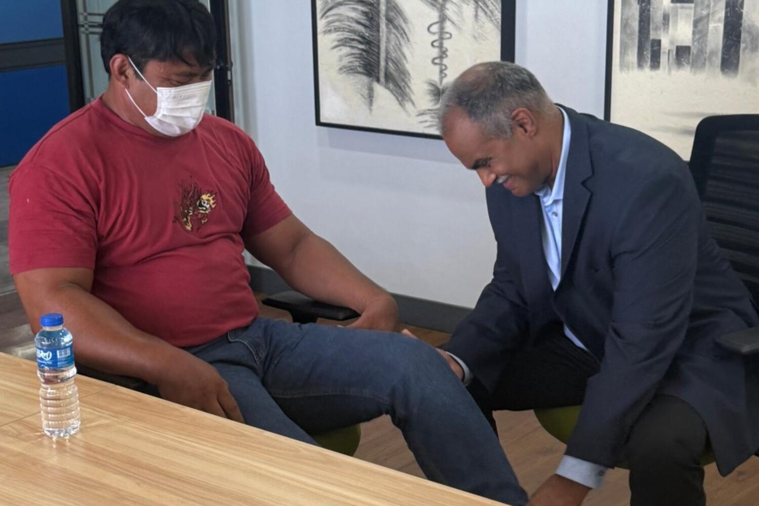 Dr. Kumar examining Brendon during pre-trip