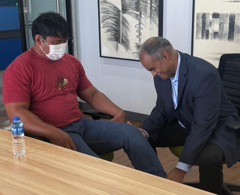 Dr. Kumar examining Brendon during pre-trip