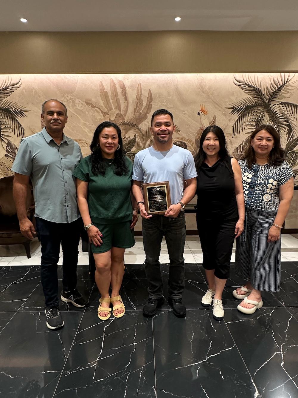 At Sir Manny Pacquiao's home. Presenting him with a token of our appreciation. L to R: Dr John Kumar; Trish Lindsey, RN; Sir Manny Pacquiao; Lisa Fujimoto-Yamaguchi, PA-C; Eleanor Barrientos, RN.